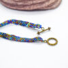 Hand Crafted Flat Metallic Beaded Wear with Bronze Toggle - Image 5