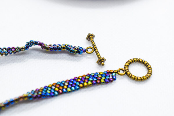 Hand Crafted Flat Metallic Beaded Wear with Bronze Toggle - Image 2